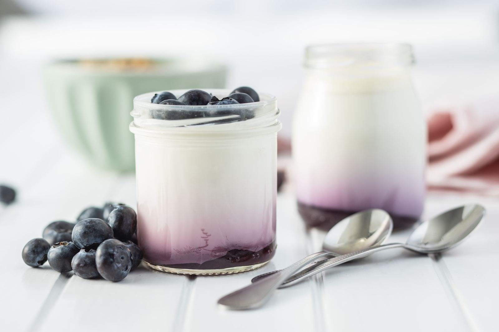 Fruit yogurt in glass jars with blueberries